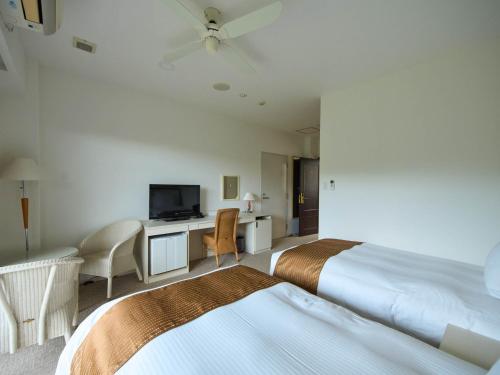 Un pat sau paturi într-o cameră la HOTEL HOLISTIC RESORT - Vacation STAY 34549v