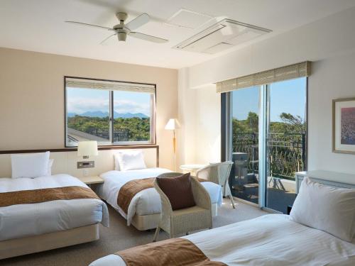 Un pat sau paturi într-o cameră la HOTEL HOLISTIC RESORT - Vacation STAY 34557v