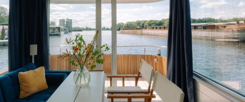 a living room with a view of a river at Spreeapartment MARA in Berlin
