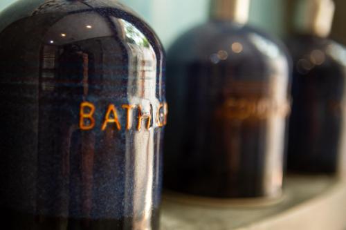 a close up of three bottles of wine on a shelf at Phong Nha Farmstay in Phong Nha