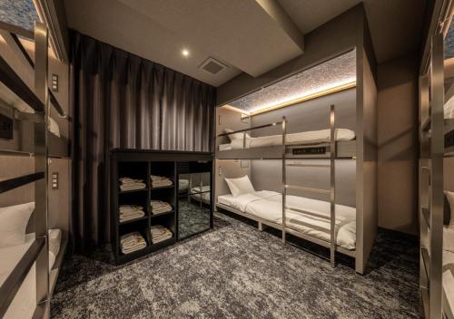 Ένα ή περισσότερα κρεβάτια σε δωμάτιο στο HOTEL GRAPHY Shibuya