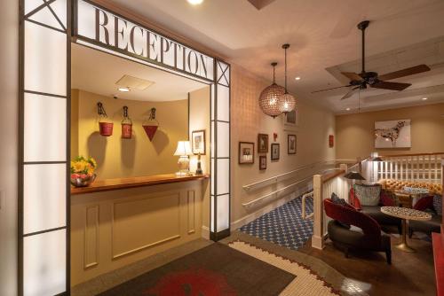 a lobby with a waiting area and a reception room at The Kendall Hotel at the Engine 7 Firehouse in Cambridge