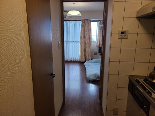 Ένα ή περισσότερα κρεβάτια σε δωμάτιο στο ホテルサンクリスター202