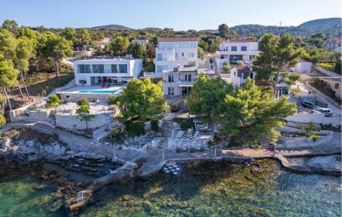 an aerial view of a house on the water at 5 Bedroom Stunning Home In Zman in Žman