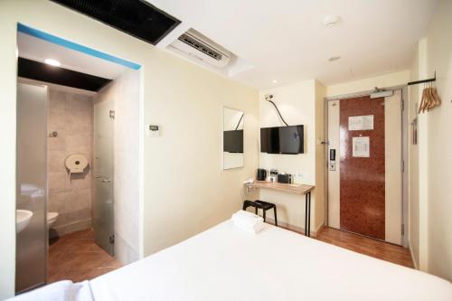 Cama o camas de una habitación en Fragrance Hotel - Balestier