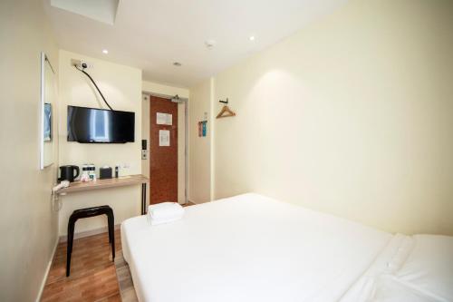 Cama o camas de una habitación en Fragrance Hotel - Balestier