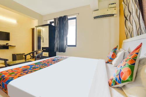 a bedroom with a large bed in a room at Hotel Dewa - Nr Dabolim Airport in Vasco Da Gama