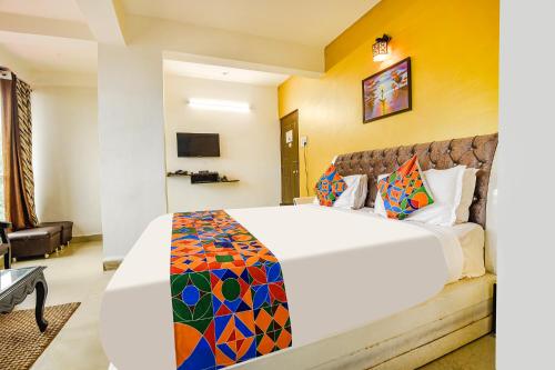 a bedroom with a large bed in a room at Hotel Dewa - Nr Dabolim Airport in Vasco Da Gama