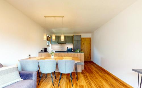 a kitchen and dining room with a table and chairs at Haus Moritz in Oetz