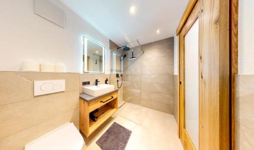 a bathroom with a sink and a mirror at Haus Moritz in Oetz