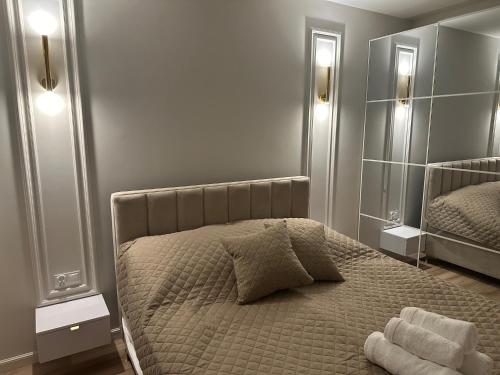 Postel nebo postele na pokoji v ubytování Apartament Kaszmir