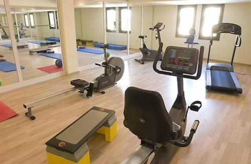 a gym with several exercise bikes and a treadmill at Alhambra Thalasso in Hammamet