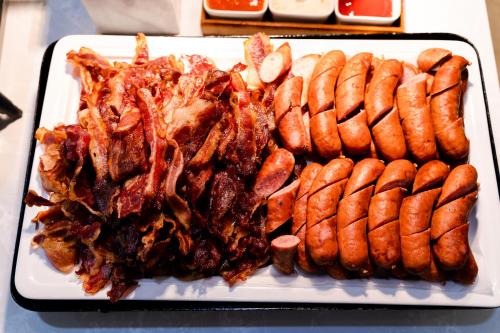 a plate of food withokedokedokedoked at Brilliant Hotel - Afternoon Tea Inclusive in Da Nang