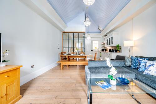 a living room with a couch and a table at Welcome London St Martin's in London
