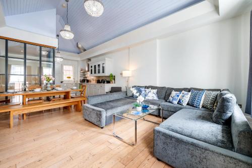 a living room with a couch and a table at Welcome London St Martin's in London