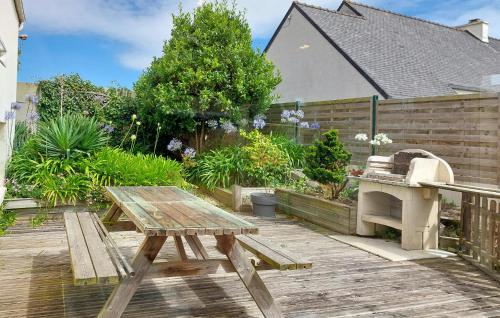 a wooden picnic table sitting on a wooden deck at 4 Bedroom Gorgeous Home In Sibiril in Sibiril