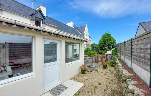 a house with a white door and a fence at 4 Bedroom Gorgeous Home In Sibiril in Sibiril