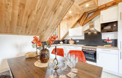 a kitchen with a table with wine glasses on it at Kleiner Fuchs in Irrhausen