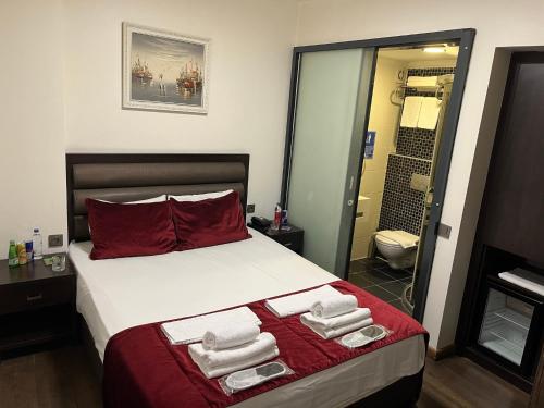 Postel nebo postele na pokoji v ubytování Pandora Hotel