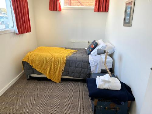 Ένα ή περισσότερα κρεβάτια σε δωμάτιο στο Cbay Executive Accommodation