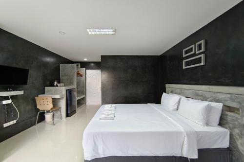Postel nebo postele na pokoji v ubytování Nano Place Hotel