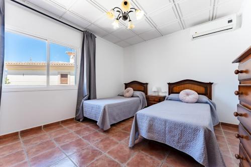 Ένα ή περισσότερα κρεβάτια σε δωμάτιο στο Villa Paula Los Manantiales
