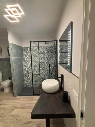 a bathroom with a toilet and a shower at Agriturismo B&B La Cerasa in Fabriano