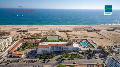 an aerial view of a resort and the beach at Hotel Vasco Da Gama in Monte Gordo
