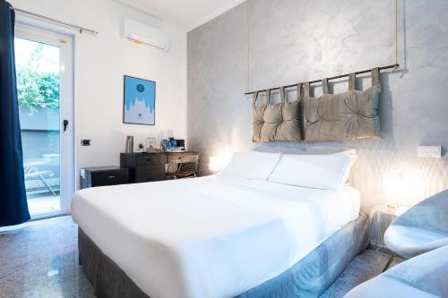 Postel nebo postele na pokoji v ubytování Città Studi Suites - Top Collection