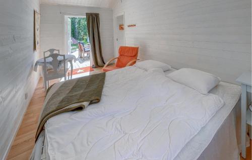 a bedroom with a large bed in a room at 3 Bedroom Cozy Home In Jönköping in Jönköping