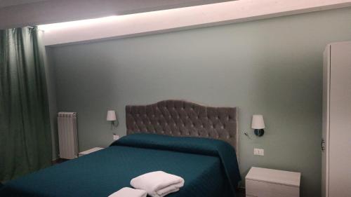 Ένα ή περισσότερα κρεβάτια σε δωμάτιο στο B&B La Dimora di Gioacchino