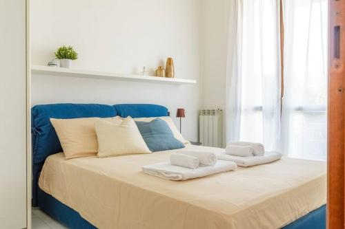 a large bed with towels on top of it at "Panorama sul Lago" Lake Maggiore, Free Wifi Netflix and Tennis in Brezzo