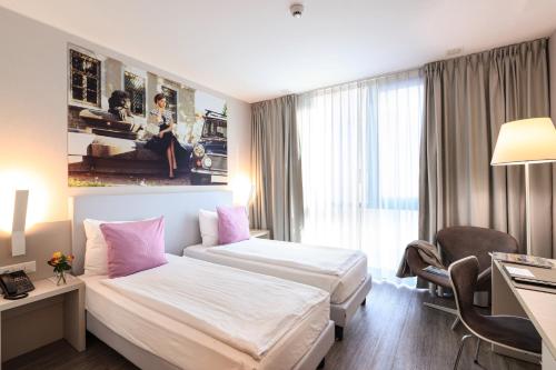 Postel nebo postele na pokoji v ubytování Hotel City Lugano