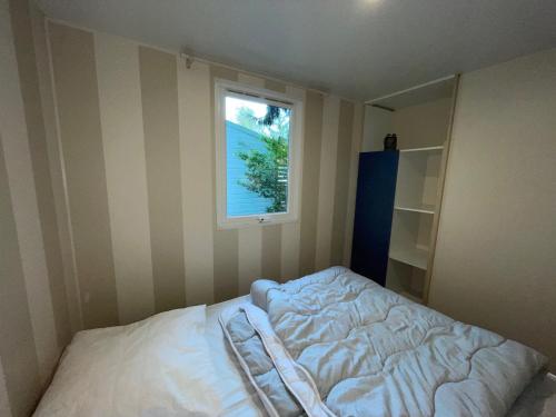 Кровать или кровати в номере Evasion au cœur de l'Alsace - Bungalow familial pour 5
