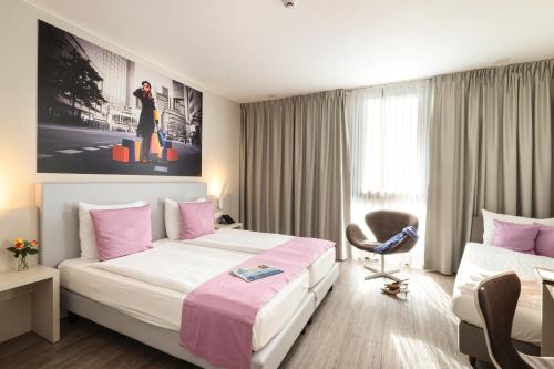 Ένα ή περισσότερα κρεβάτια σε δωμάτιο στο Hotel City Lugano