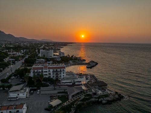 an aerial view of a city at sunset at Manolya Hotel in Kérynia