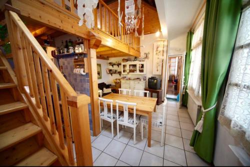 a kitchen and dining room with a wooden table and chairs at Appartamento nel centro di Forte dei Marmi in Forte dei Marmi