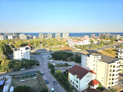 an aerial view of a city with buildings and the ocean at Marianne, Apartament 2 Camere, Stefan Lake 2, Mamaia Nord in Năvodari