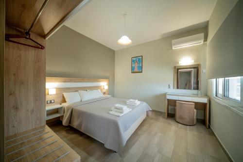 Postel nebo postele na pokoji v ubytování Hotel Olympion