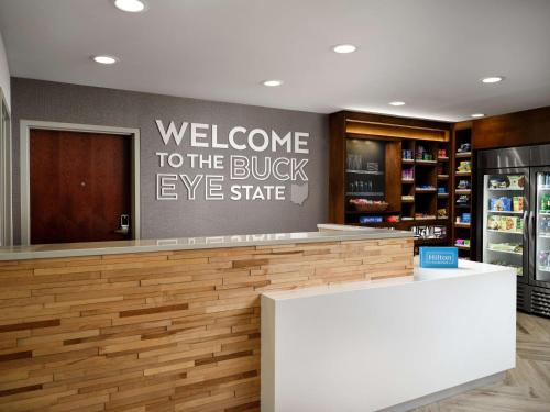 a welcome to the brick eye state sign in a store at Hampton Inn Troy in Troy