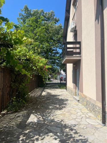 an empty alley between a building with a balcony at Big City House in Bihać