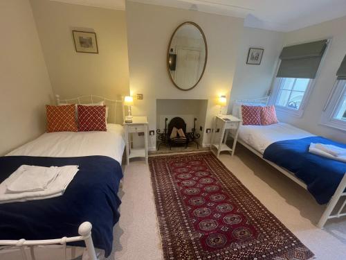 Кровать или кровати в номере The Portland Guesthouse