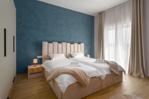 Ένα ή περισσότερα κρεβάτια σε δωμάτιο στο Vila Paris