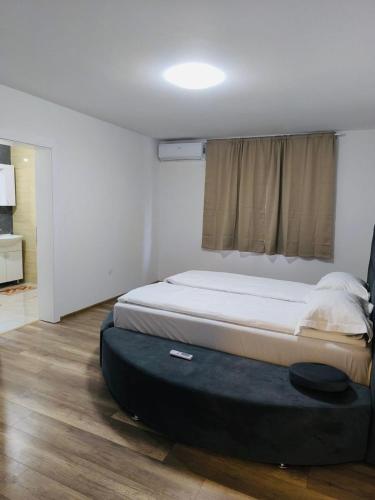 a bedroom with a large bed in a room at Villa Bellissima in Bihać