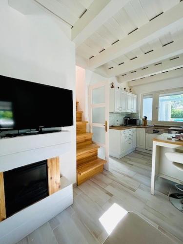 a living room with a large television on a wall at Funny Füred in Balatonfüred