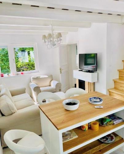 a living room with a couch and a table at Funny Füred in Balatonfüred