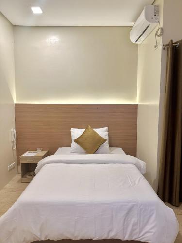 Ένα ή περισσότερα κρεβάτια σε δωμάτιο στο THE VELVET SUITES AND HOTEL