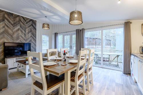 a kitchen and dining room with a table and chairs at Best Western Plus Kenwick Park Hotel in Louth