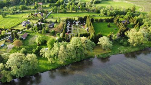 an aerial view of a house next to a river at Osada Załuż in Sanok