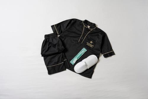a black jacket is sitting on a white surface at THE SINGULARI HOTEL & SKYSPA at UNIVERSAL STUDIOS JAPAN in Osaka